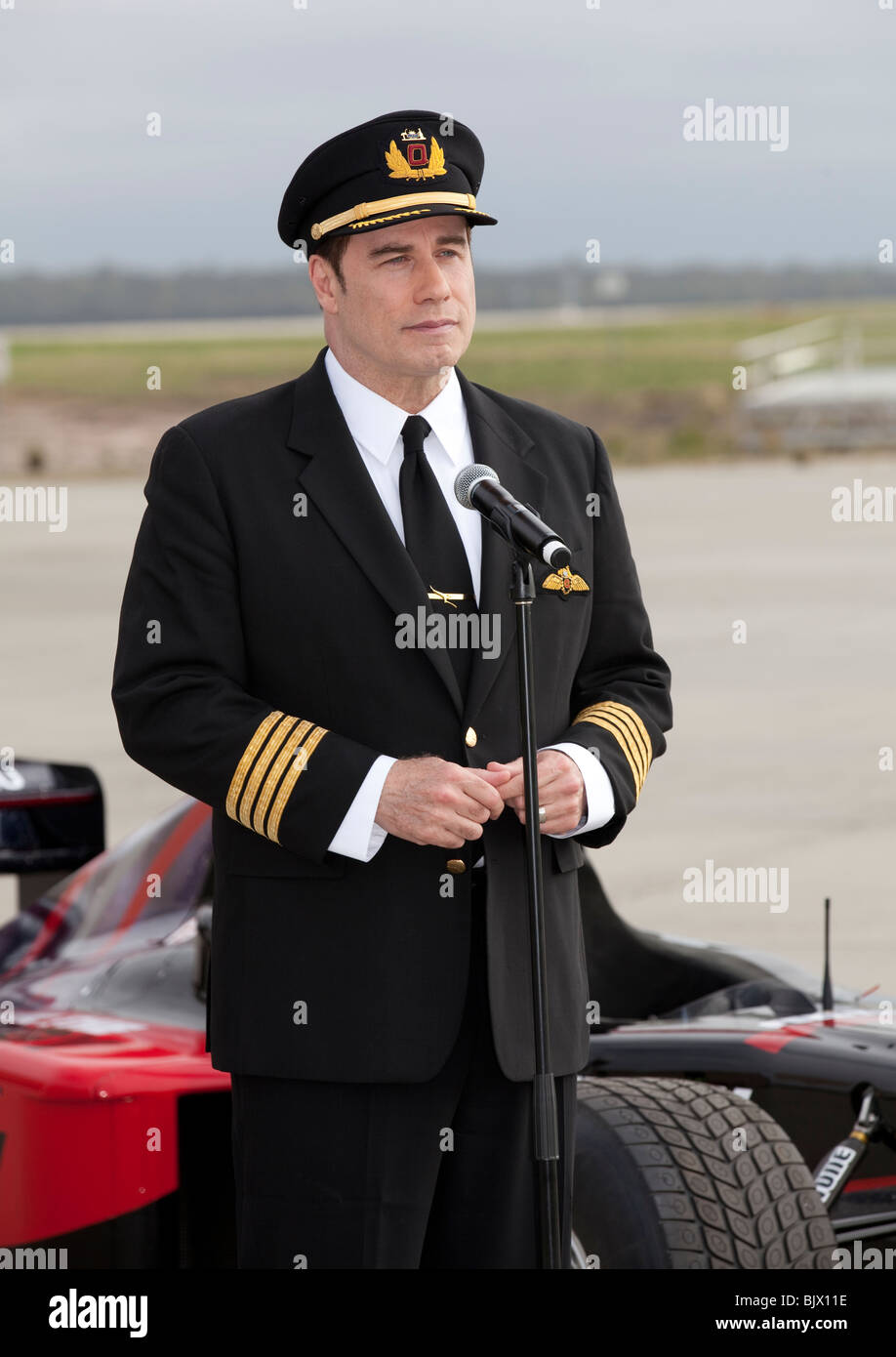 John Travolta portant l'uniforme de pilote de Qantas, aéroport de Melbourne, 2010. Banque D'Images