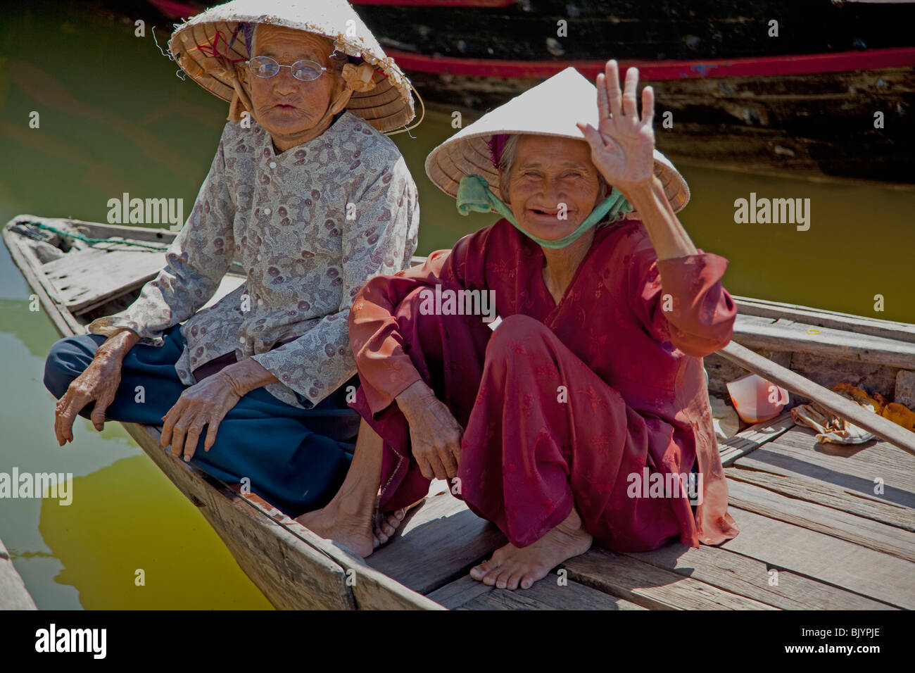 Deux professionnels de vieilles dames à Hoi An au Vietnam. Banque D'Images