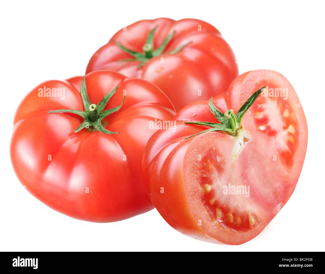 Tomates mûres sur un fond blanc Banque D'Images