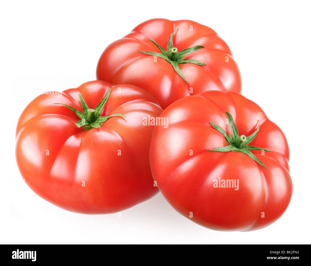 Tomates mûres sur un fond blanc Banque D'Images