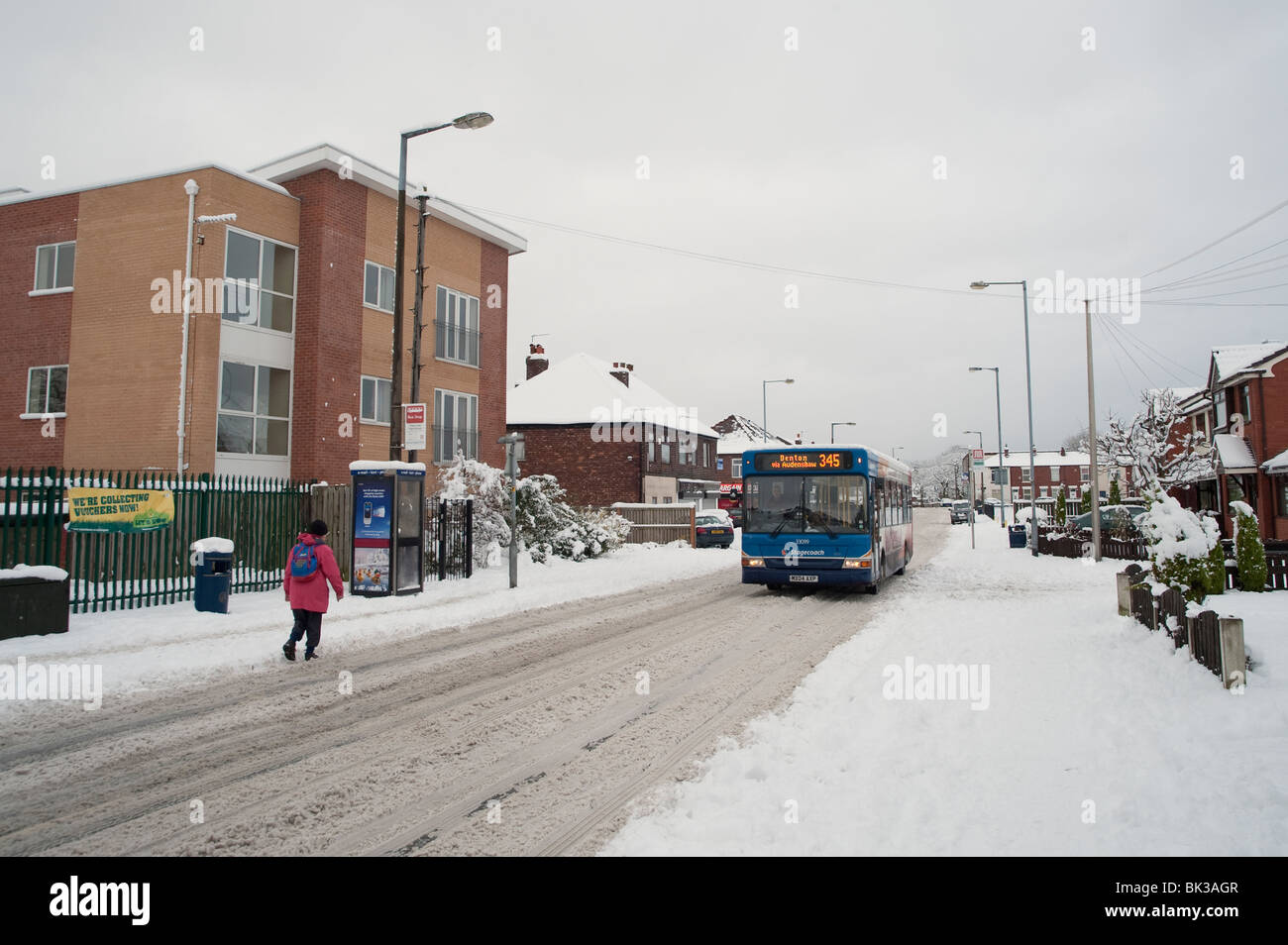 Route en hiver, Denton, Manchester, UK Banque D'Images