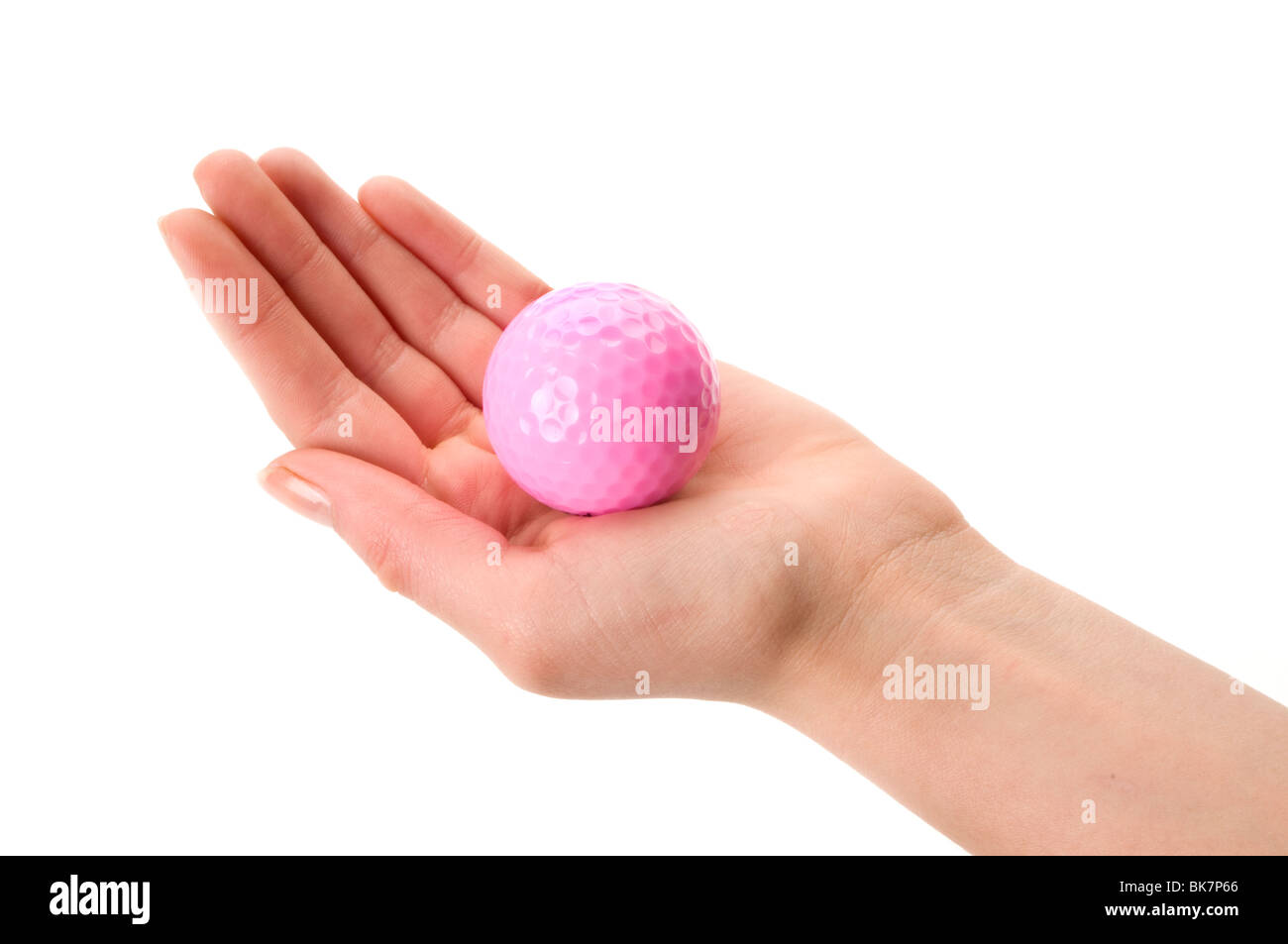 Main tenant une balle de golf rose Banque D'Images