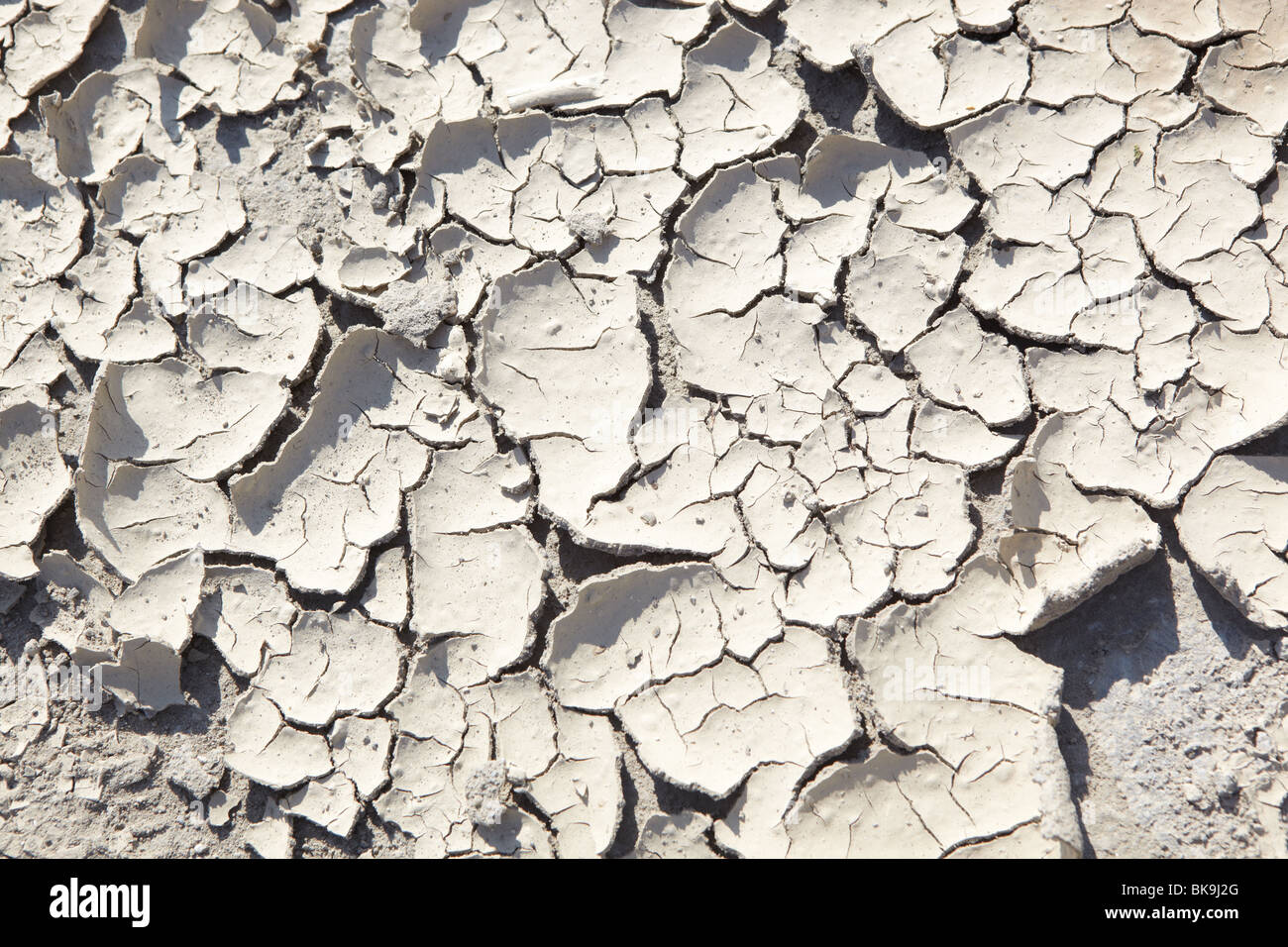 Texture d'une boue fissuré séché - texture de fond pour les dessins de conception centrée sur le réchauffement climatique. Banque D'Images