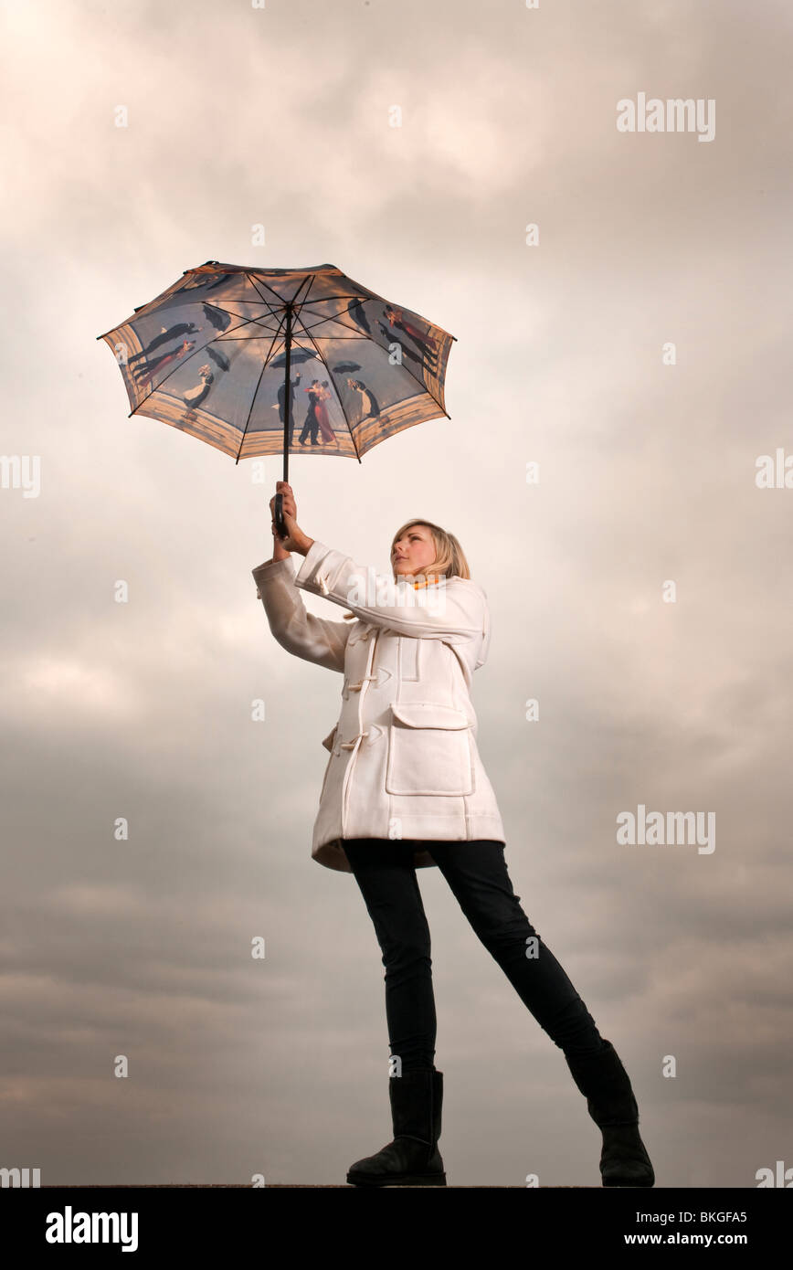 Parapluie dans le vent Banque de photographies et d'images à haute  résolution - Alamy