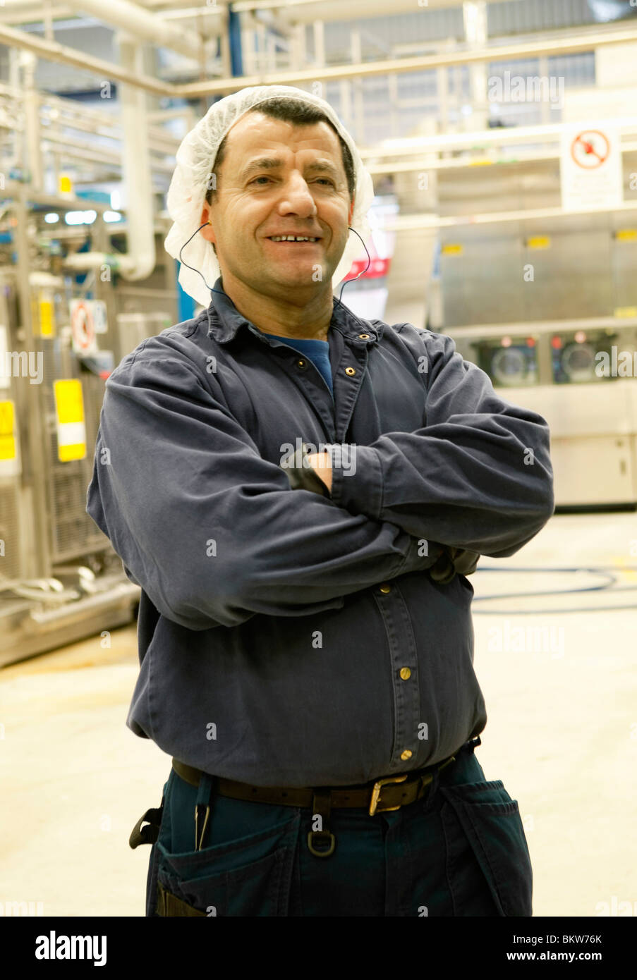 Travailleur avec bras croisés Banque D'Images