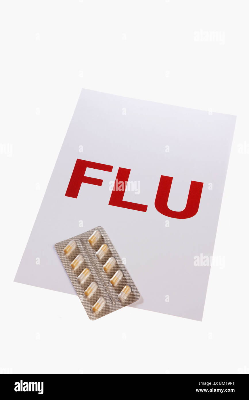 Close-up d'une plaque-étiquette de la grippe avec une plaquette de gélules Banque D'Images