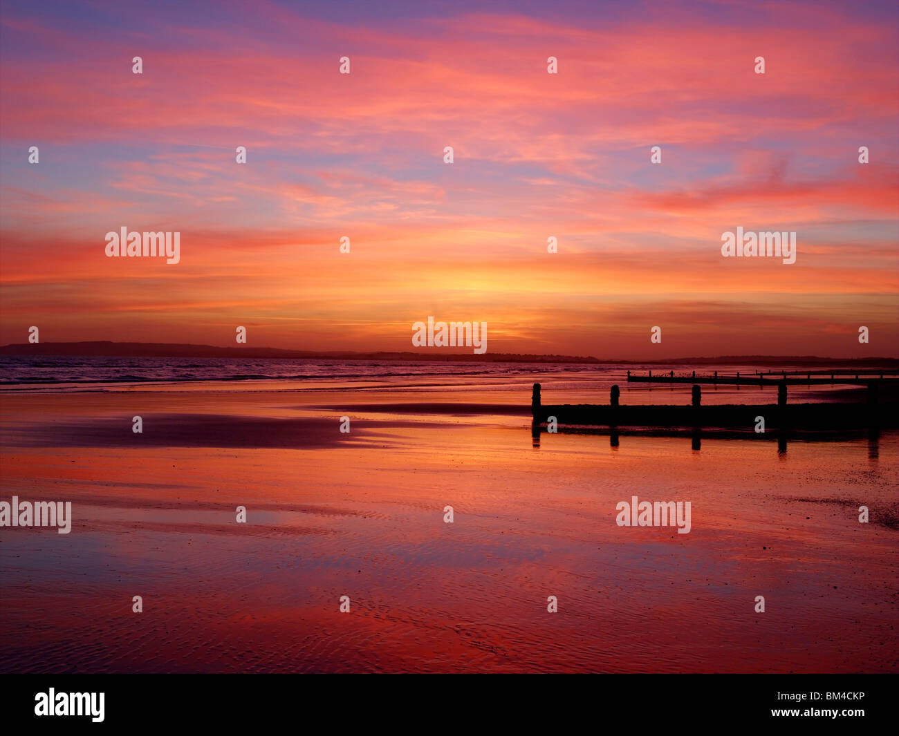 Camber Sands au coucher du soleil Banque D'Images
