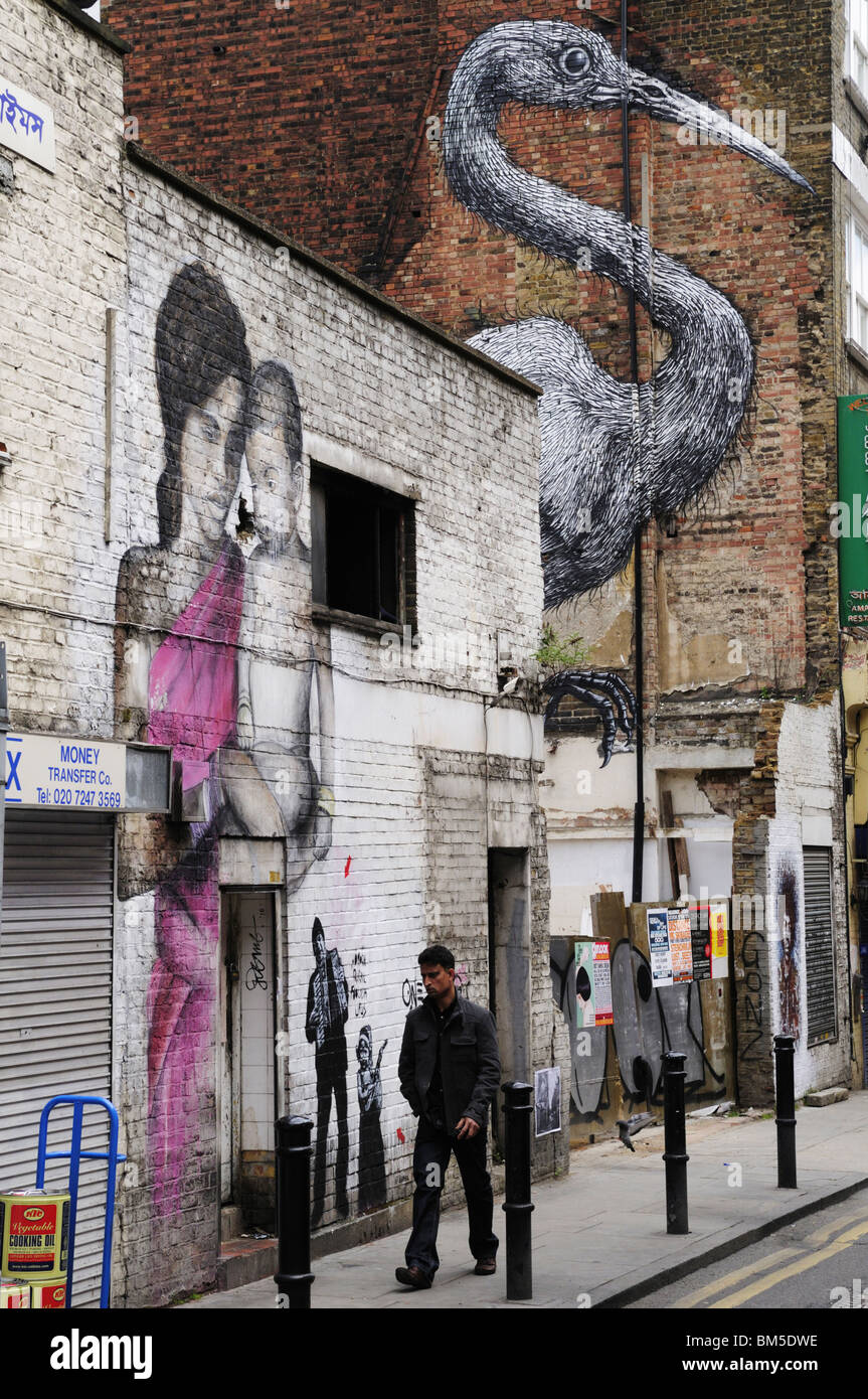 Peintures murales dans la rue rue Hanbury, au large de Brick Lane, London, England, UK Banque D'Images