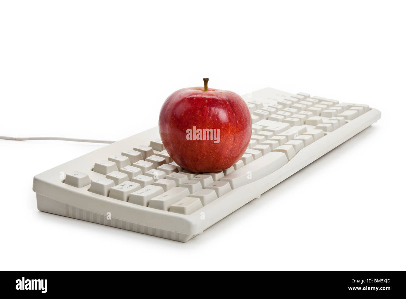 Clavier de l'ordinateur et red apple close up Banque D'Images