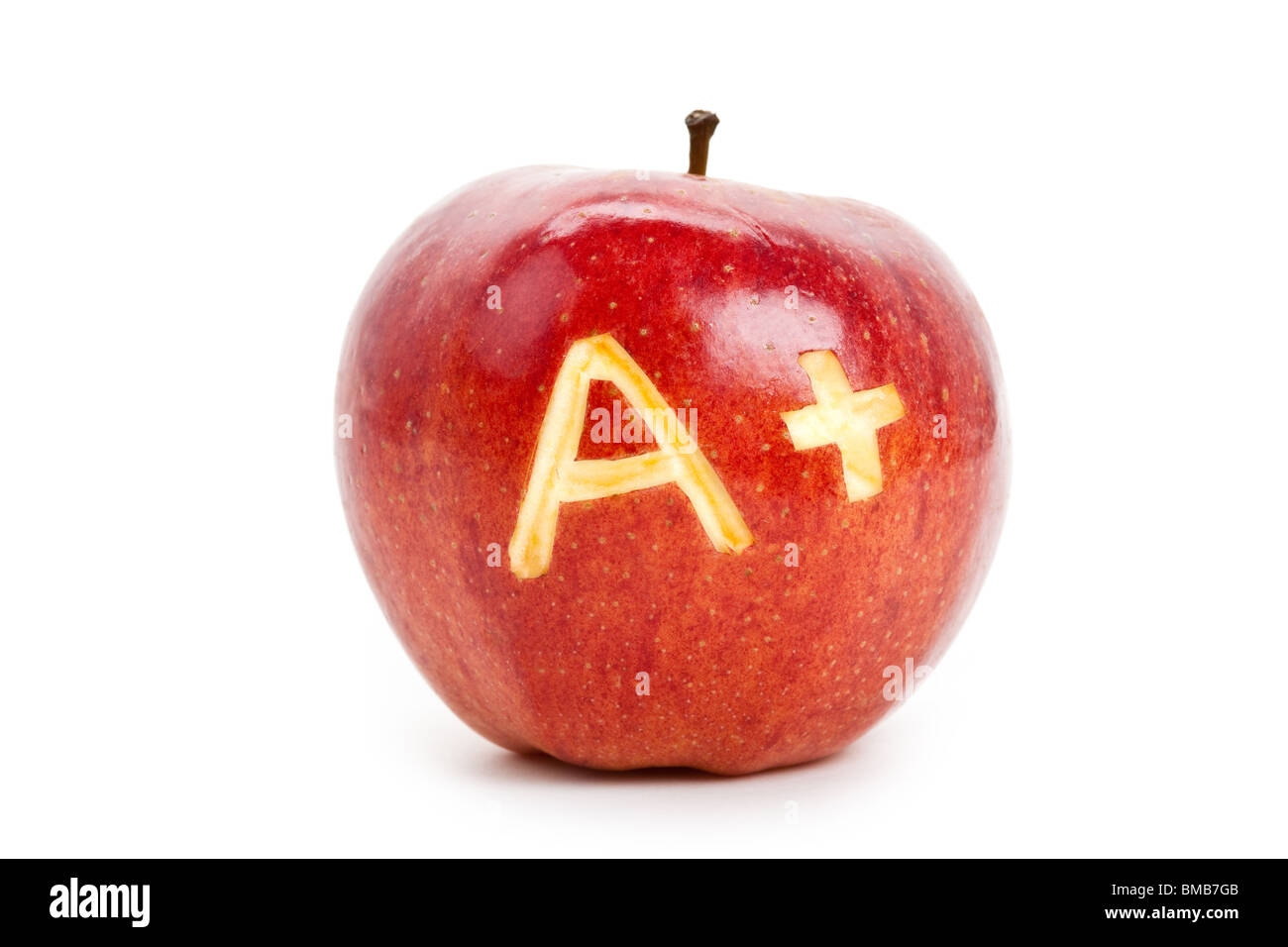 Pomme rouge et un signe plus, Concept de l'apprentissage Banque D'Images