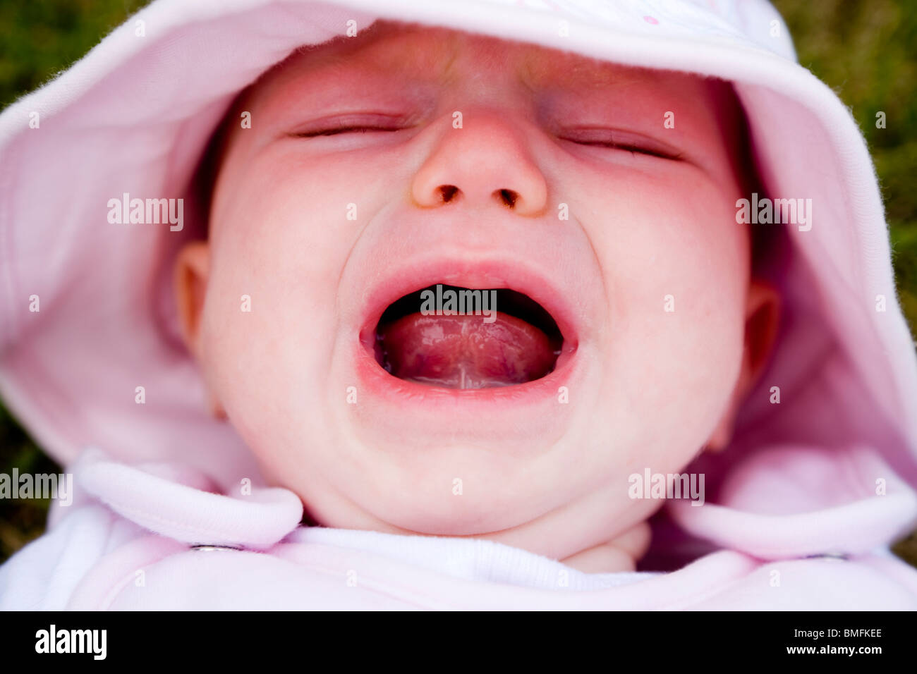 Visage d'un malheureux bébé pleurer / pleurer / cris / scream / crier. Banque D'Images