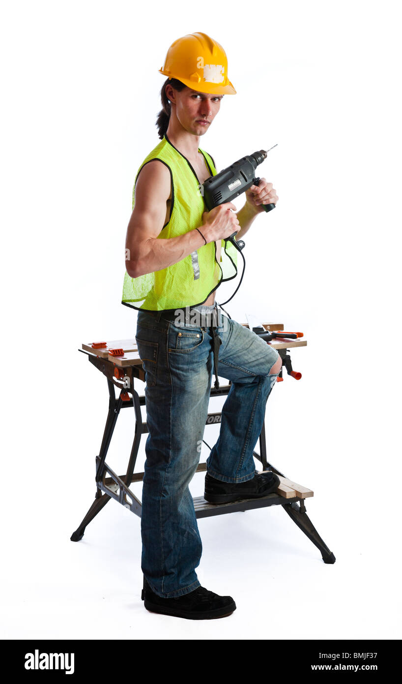 Workman avec des outils et un établi Banque D'Images