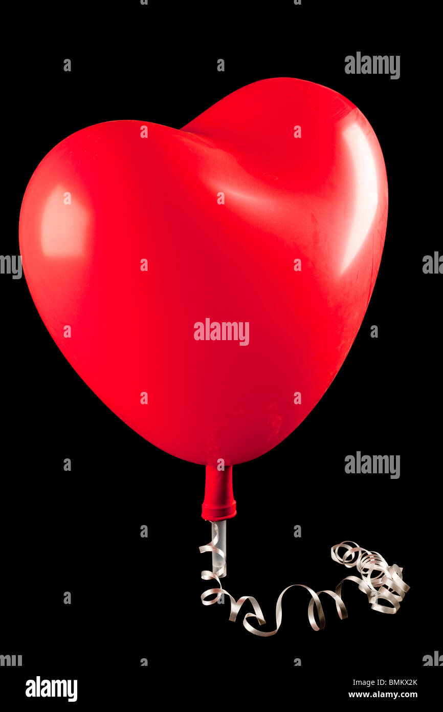 Un ballon en forme de coeur rouge Banque D'Images