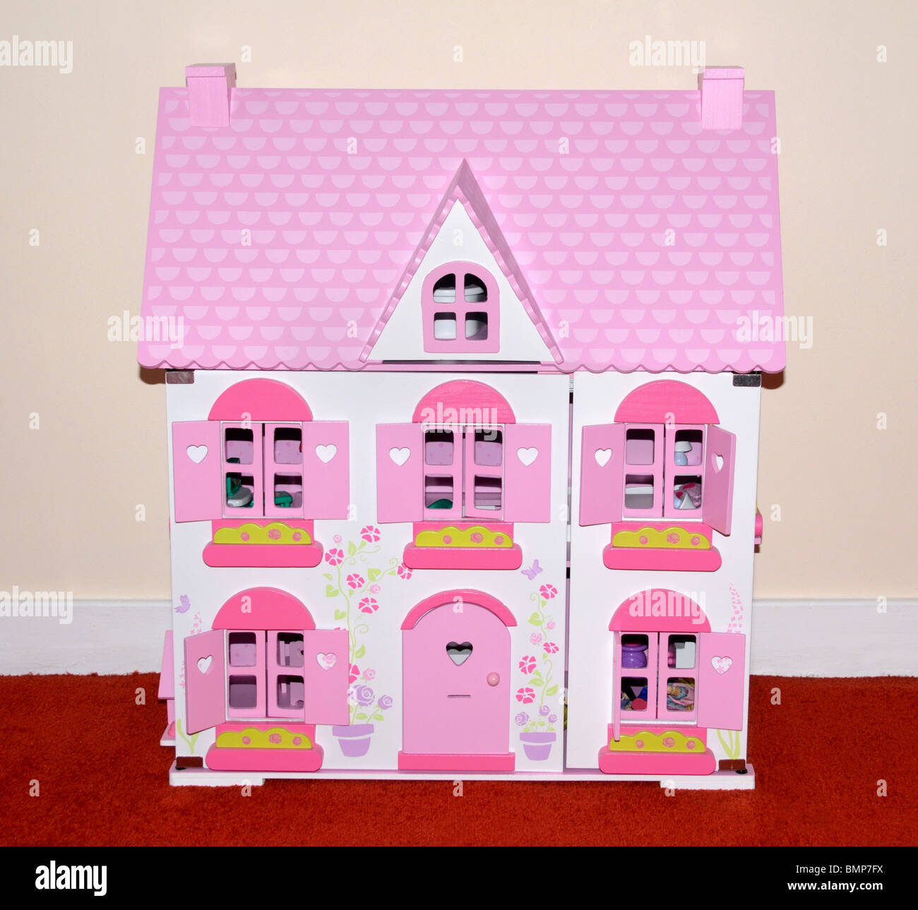 Une maison de poupées rose et blanc. Banque D'Images