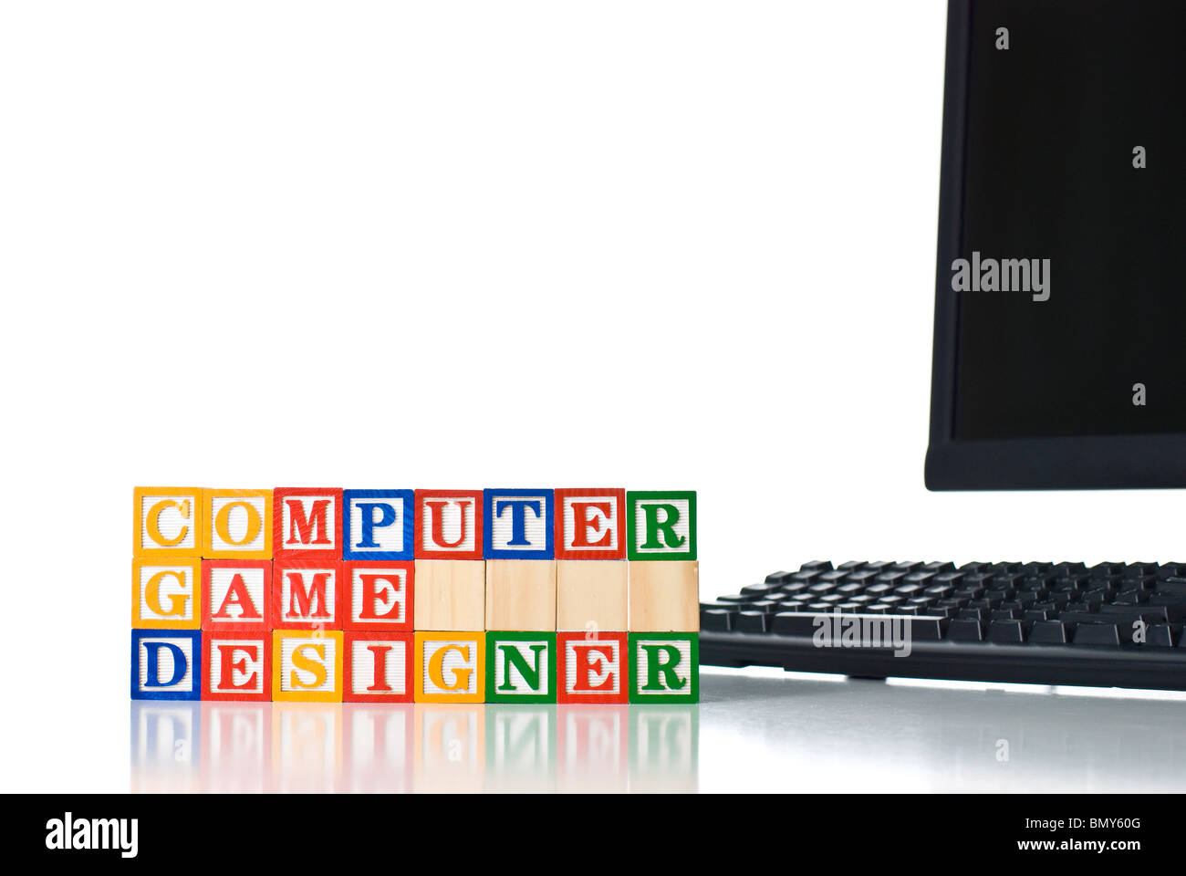 Enfants colorés blocks spelling concepteur de jeu d'ordinateur avec clavier et moniteur Banque D'Images