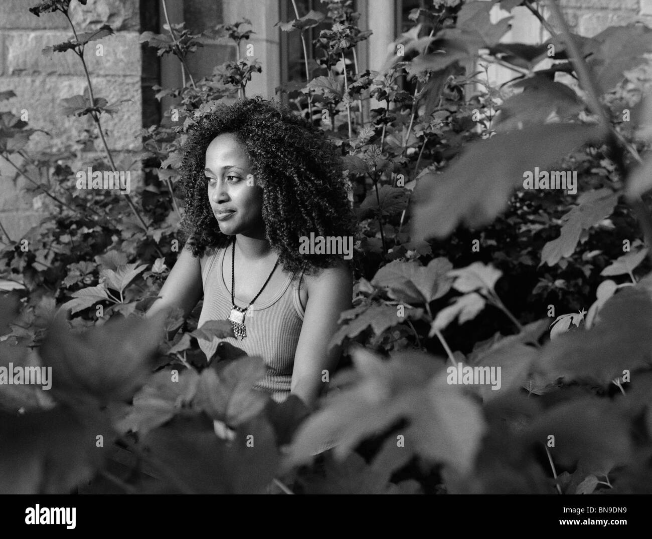 Mixed Race woman in garden Banque D'Images