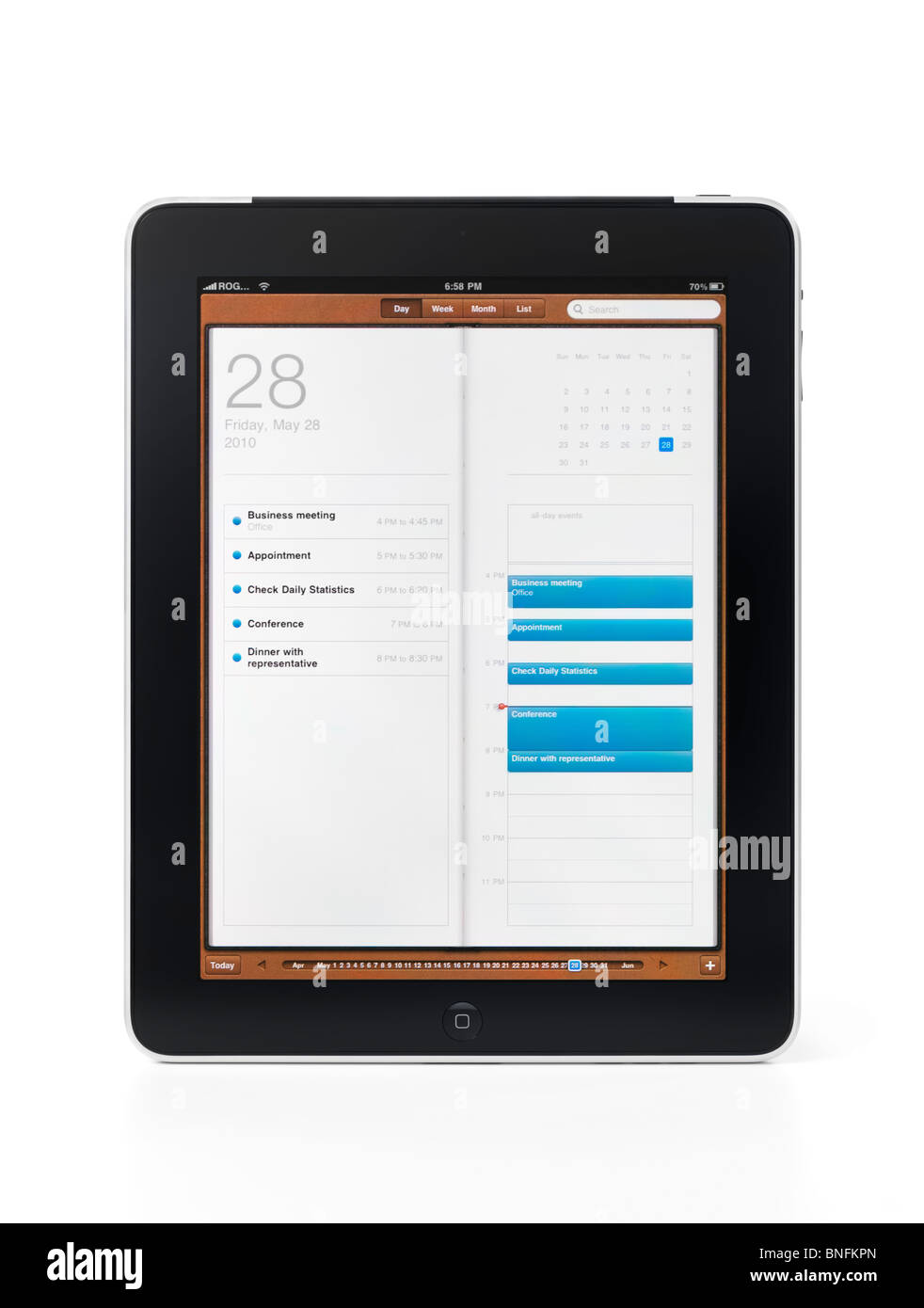 Apple iPad 3G tablet avec organiseur application Calendrier avec la liste des événements et des rendez-vous d'affaires sur son afficheur. Isolé Banque D'Images