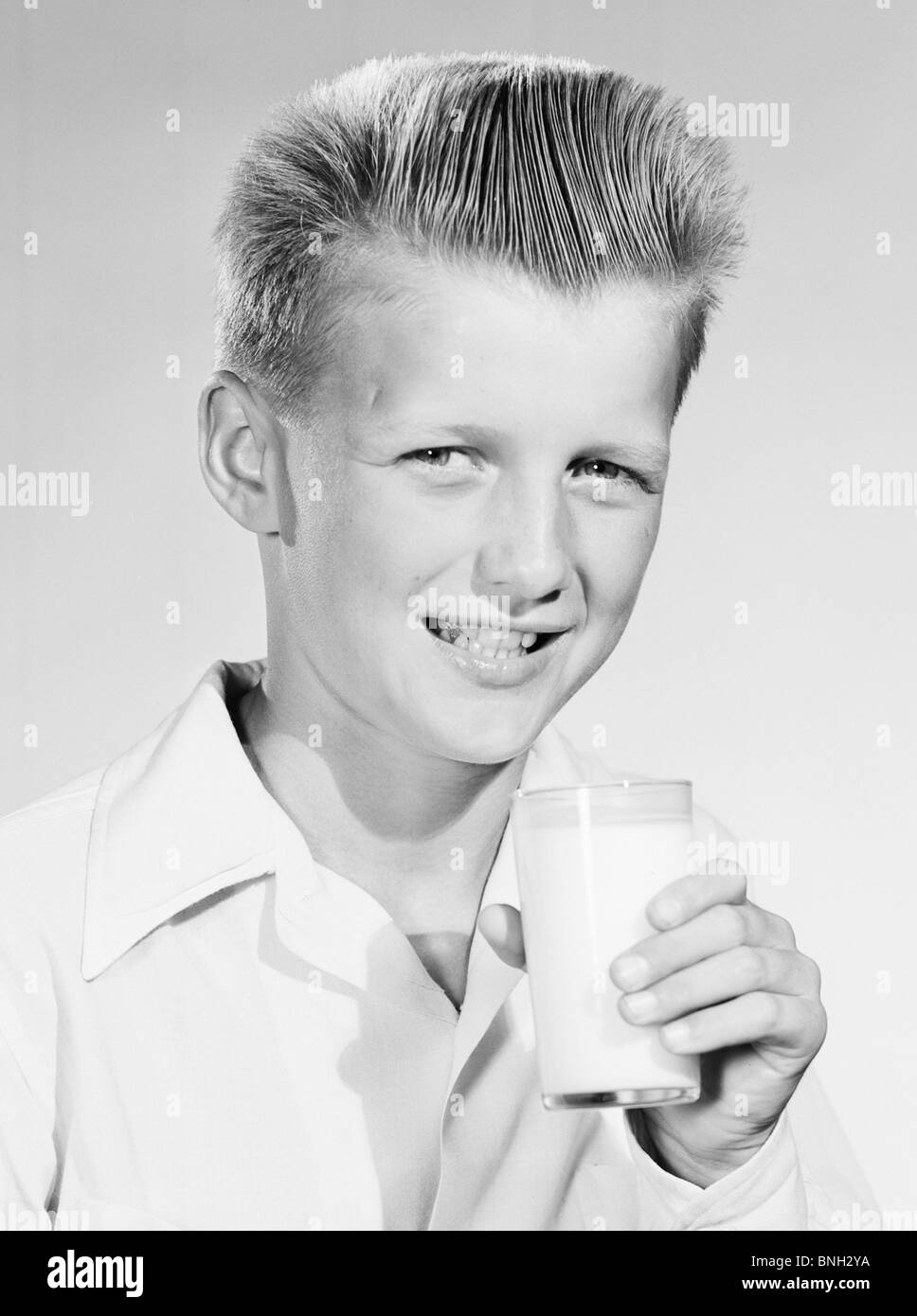 Portrait of a Boy holding a glass of milk Banque D'Images