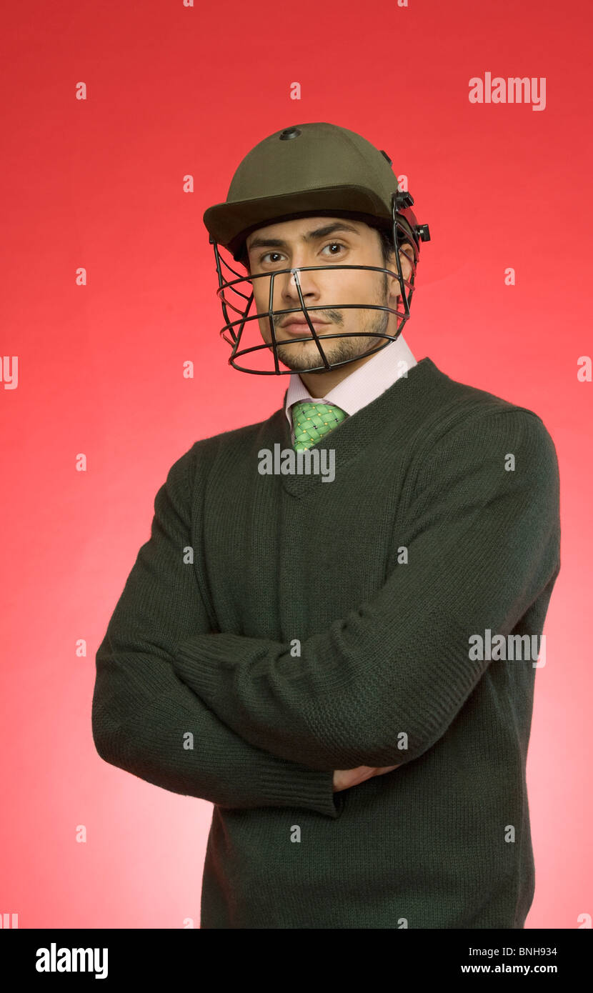 Businessman wearing a helmet cricket Banque D'Images
