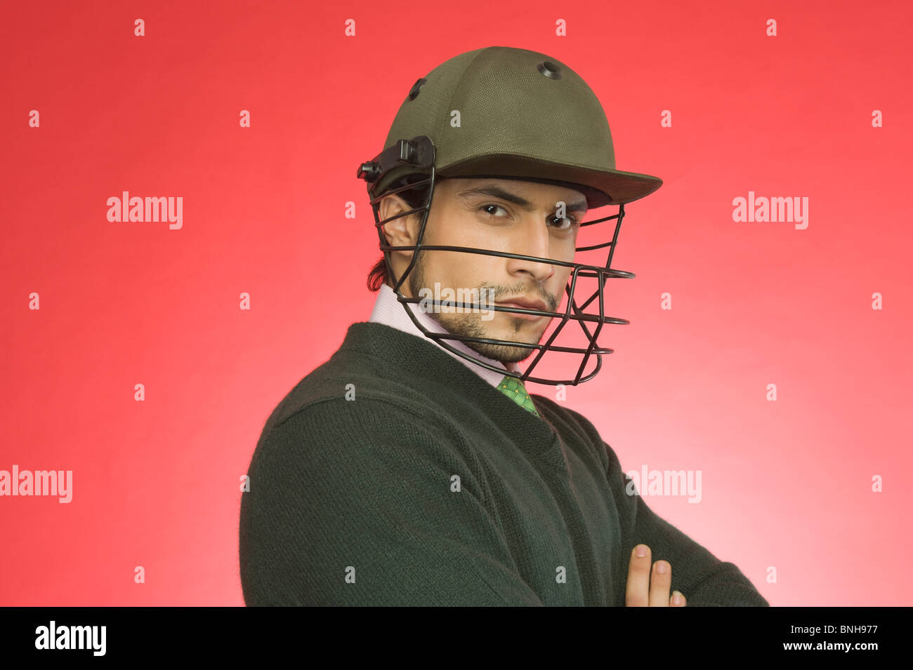 Businessman wearing a helmet cricket Banque D'Images
