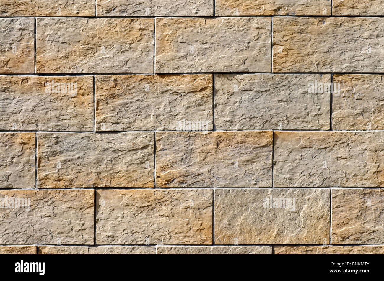 Mur avec des carreaux en pierre appliquée - France. Banque D'Images