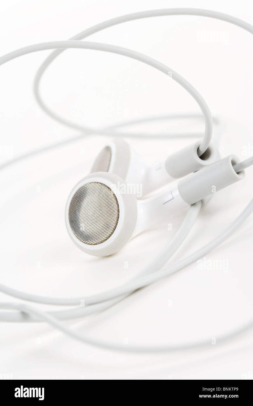 Écouteurs blancs, concept de la musique numérique Banque D'Images