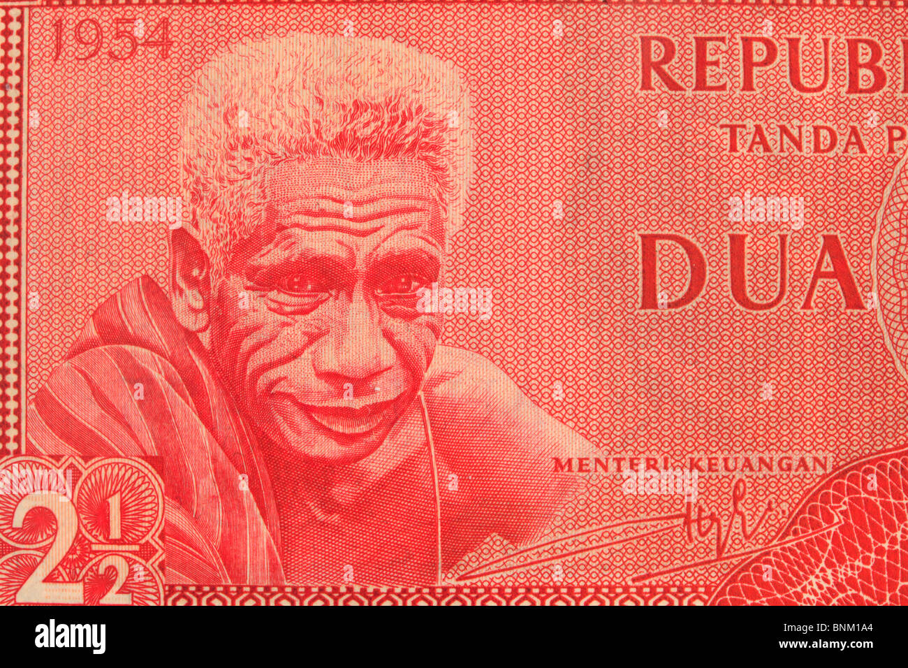Vintage monnaie indonésienne bank note close up d'un vieil homme, tout rouge Banque D'Images