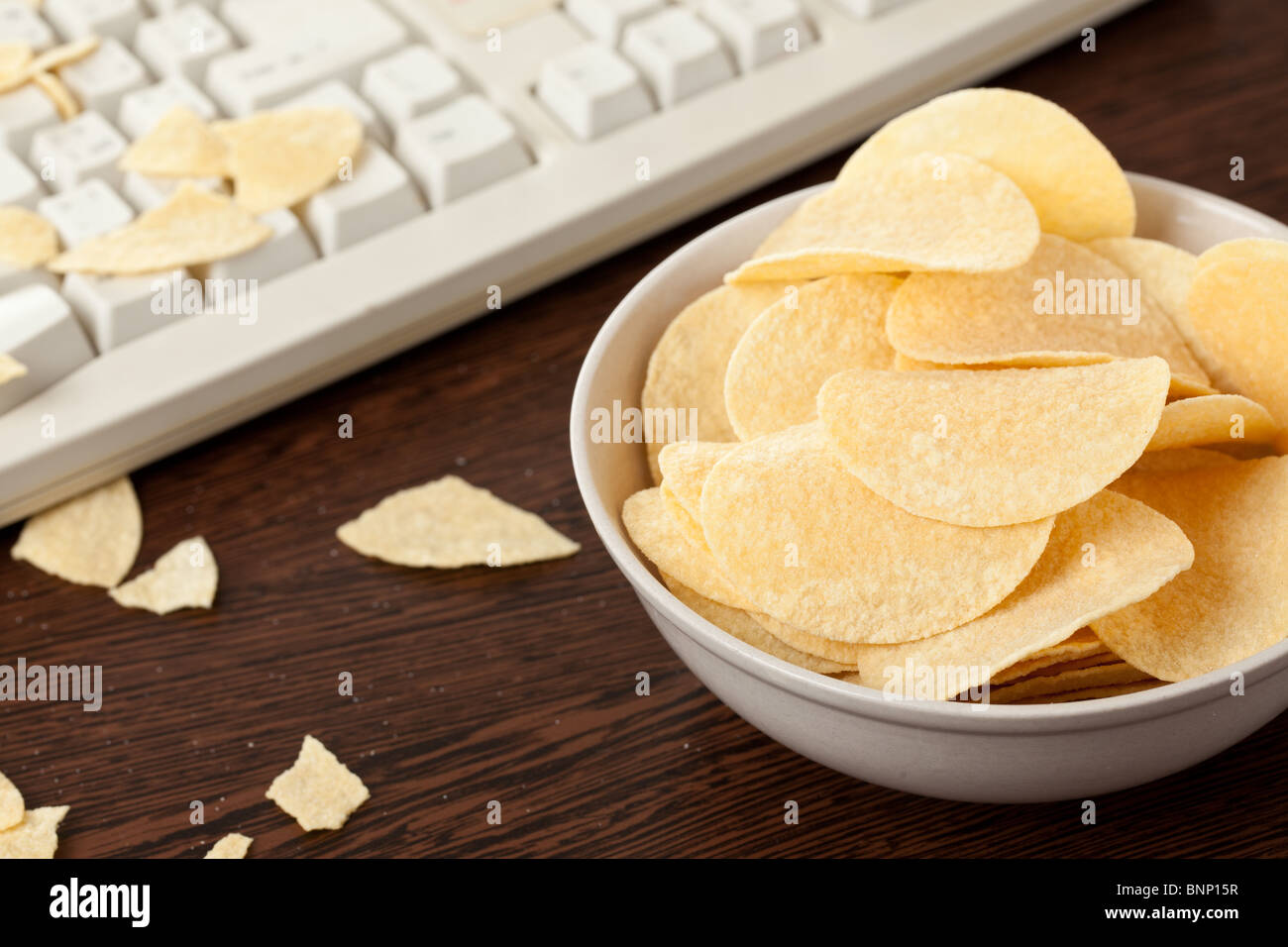 Croustilles de pommes de terre et le clavier Banque D'Images