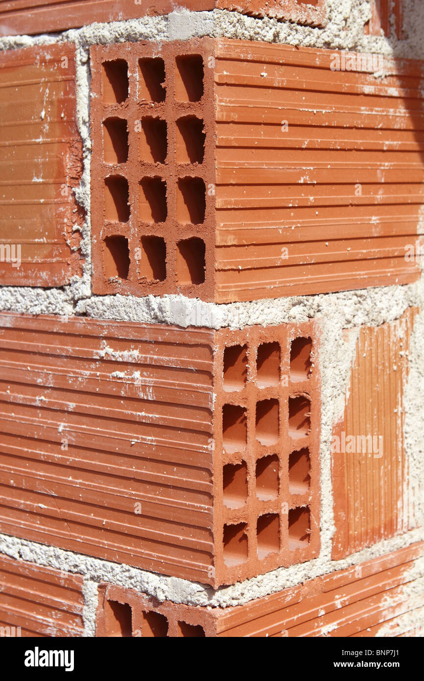 Construction en brique rouge coin creux briques en terre airbrick Banque D'Images