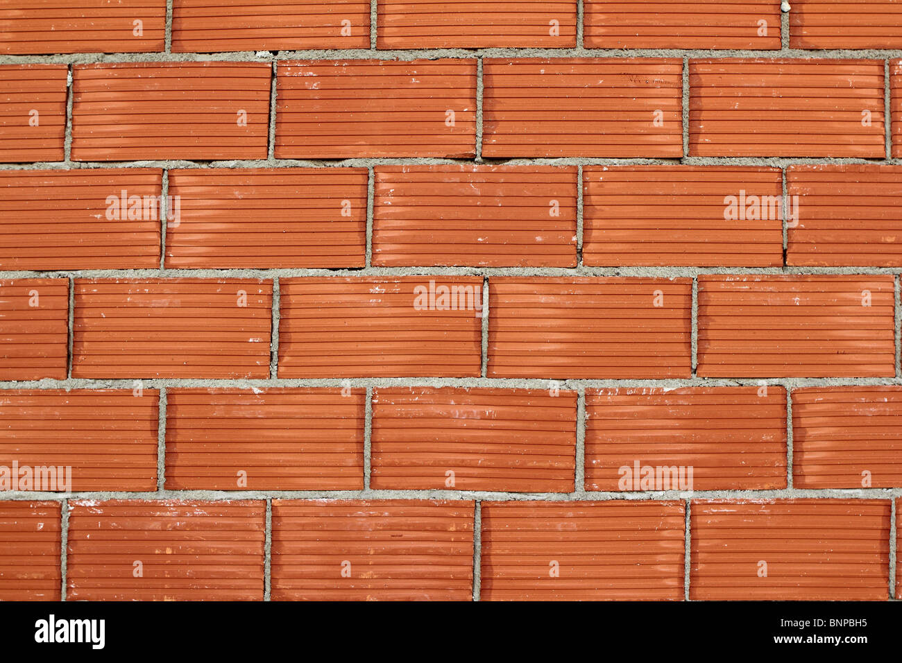 Mur de brique d'argile rouge construction airbrick la texture de fond Banque D'Images