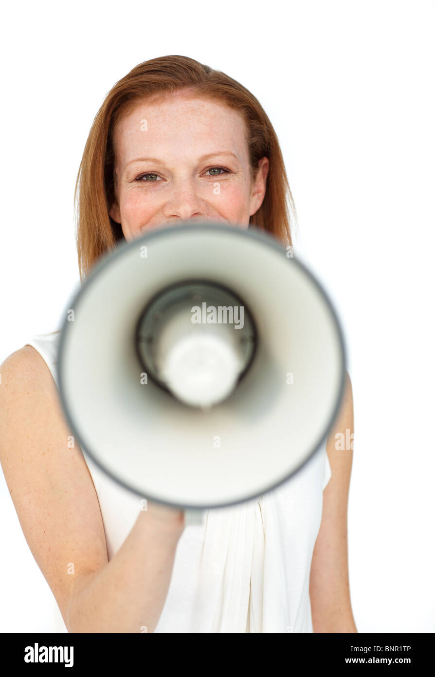 Smiling businesswoman using a megaphone Banque D'Images