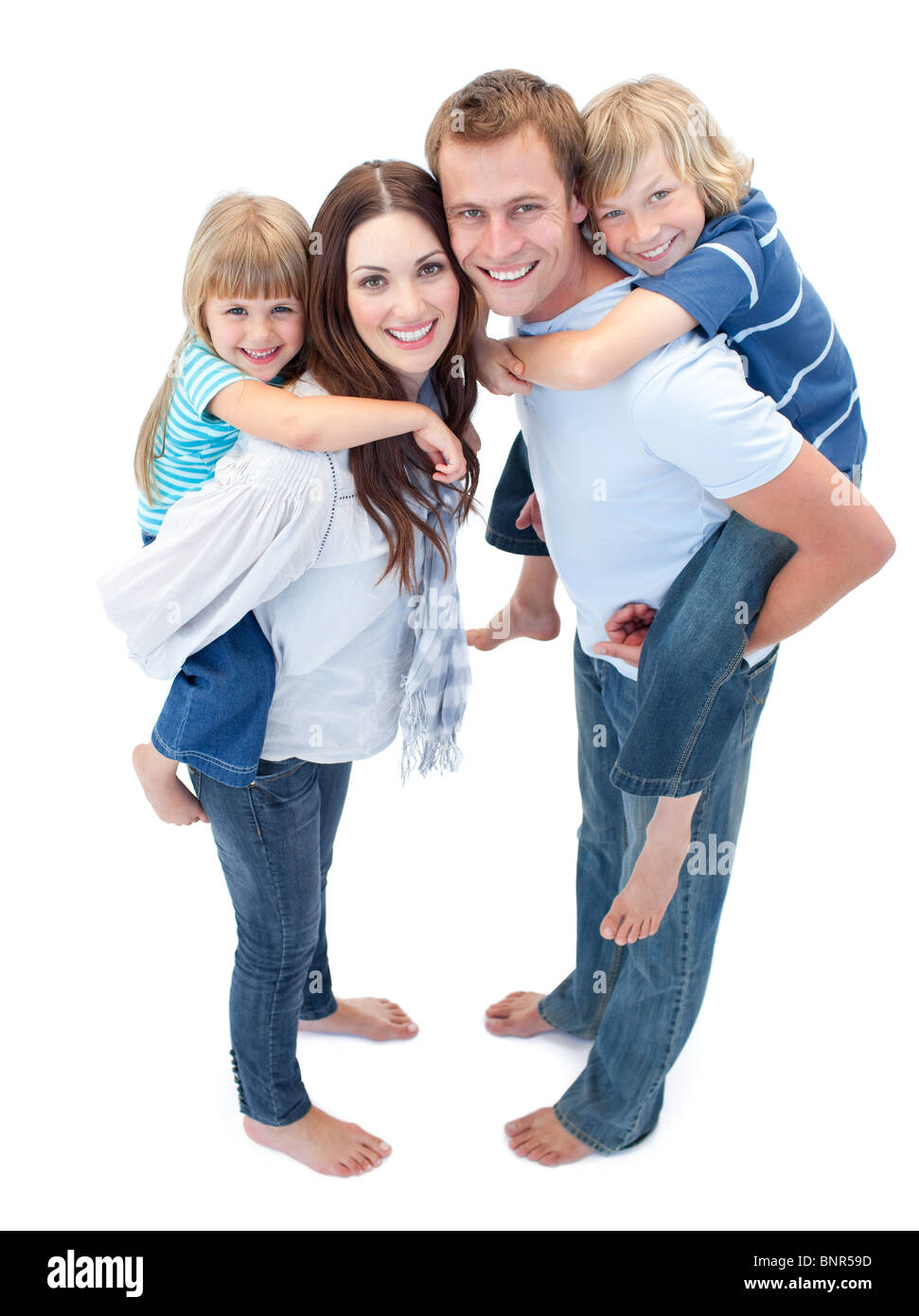 Smiling Family Against A White Background Banque D'Images