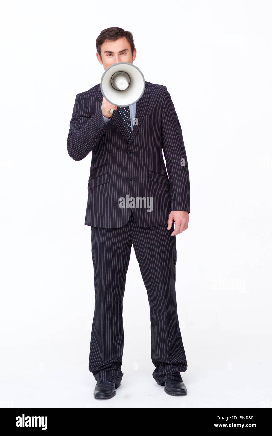 Attractive businessman shouting through a megaphone Banque D'Images