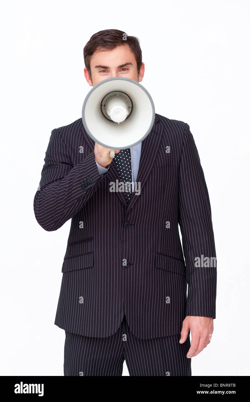 Young businessman shouting through a megaphone Banque D'Images