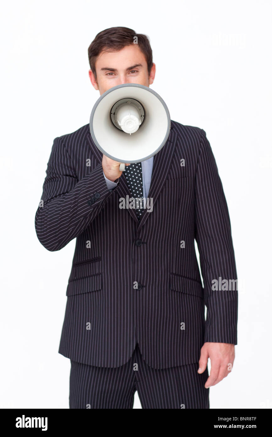 Handsome businessman shouting through a megaphone Banque D'Images