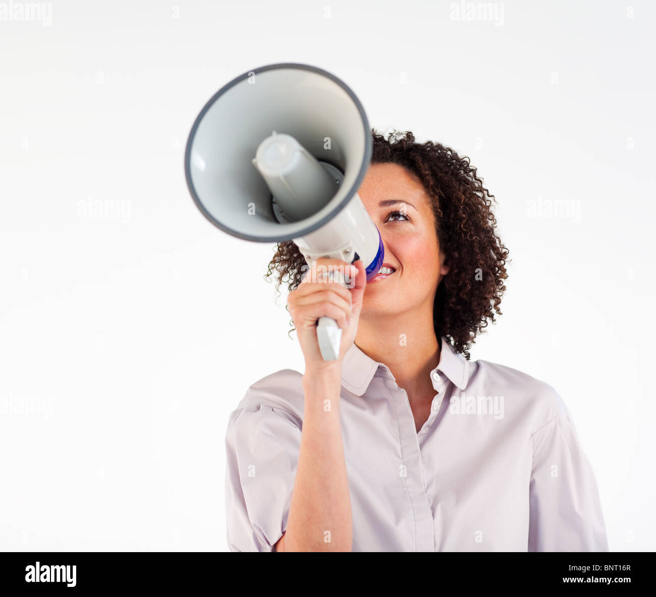 Businesswoman crier par mégaphone Banque D'Images