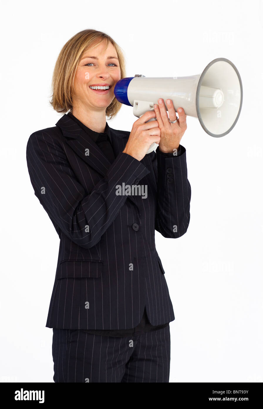 Businesswoman avec un mégaphone smiling at the camera Banque D'Images