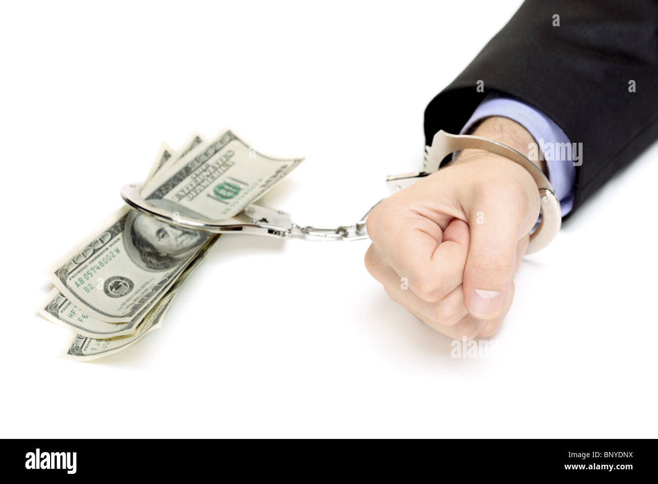 Part avec des menottes et dollars US Banque D'Images