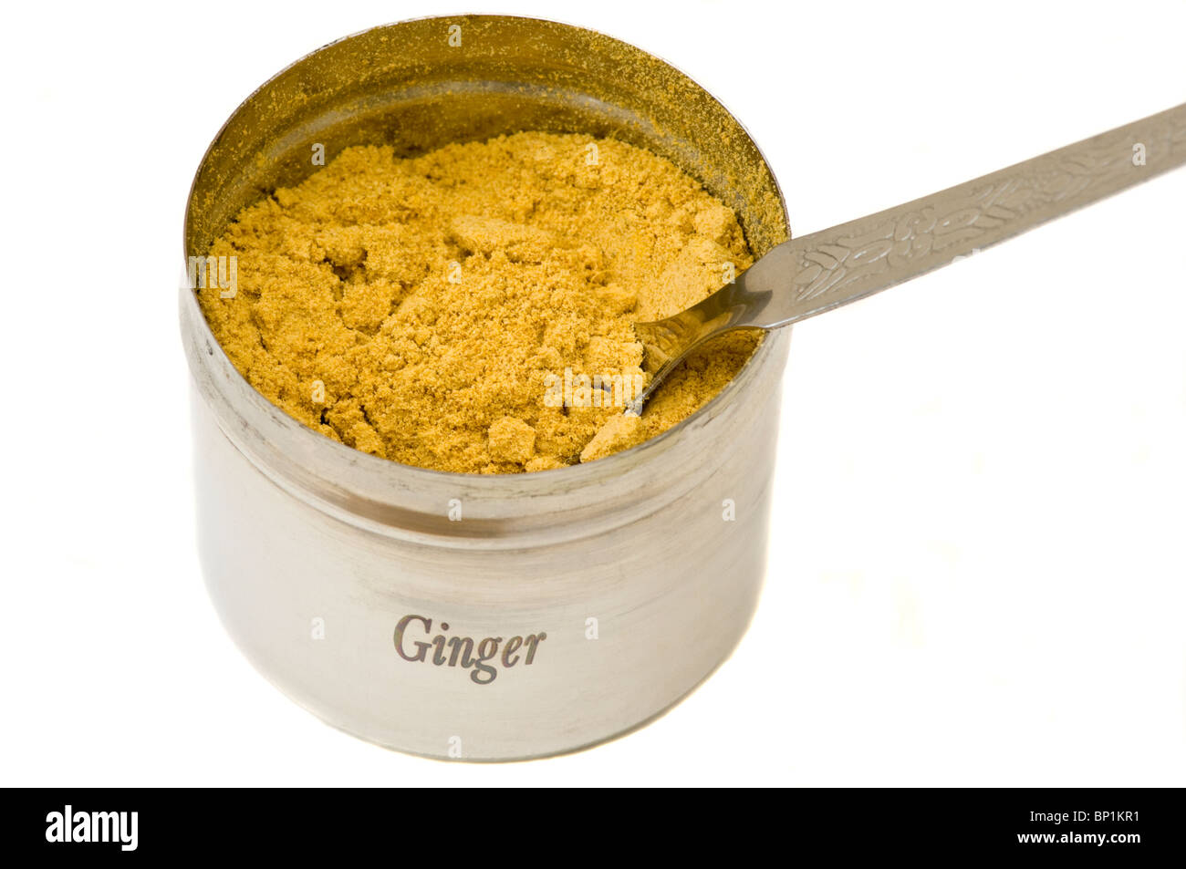 Un pot de gingembre en poudre avec une cuillère d'Épices Banque D'Images