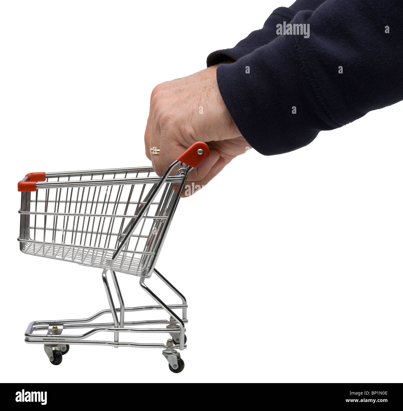 Man's hands pushing shopping trolley Banque D'Images