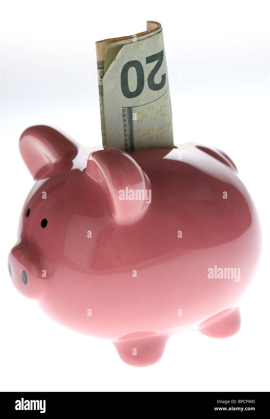 Pink piggy bank avec 20 dollar note sur fond blanc Banque D'Images