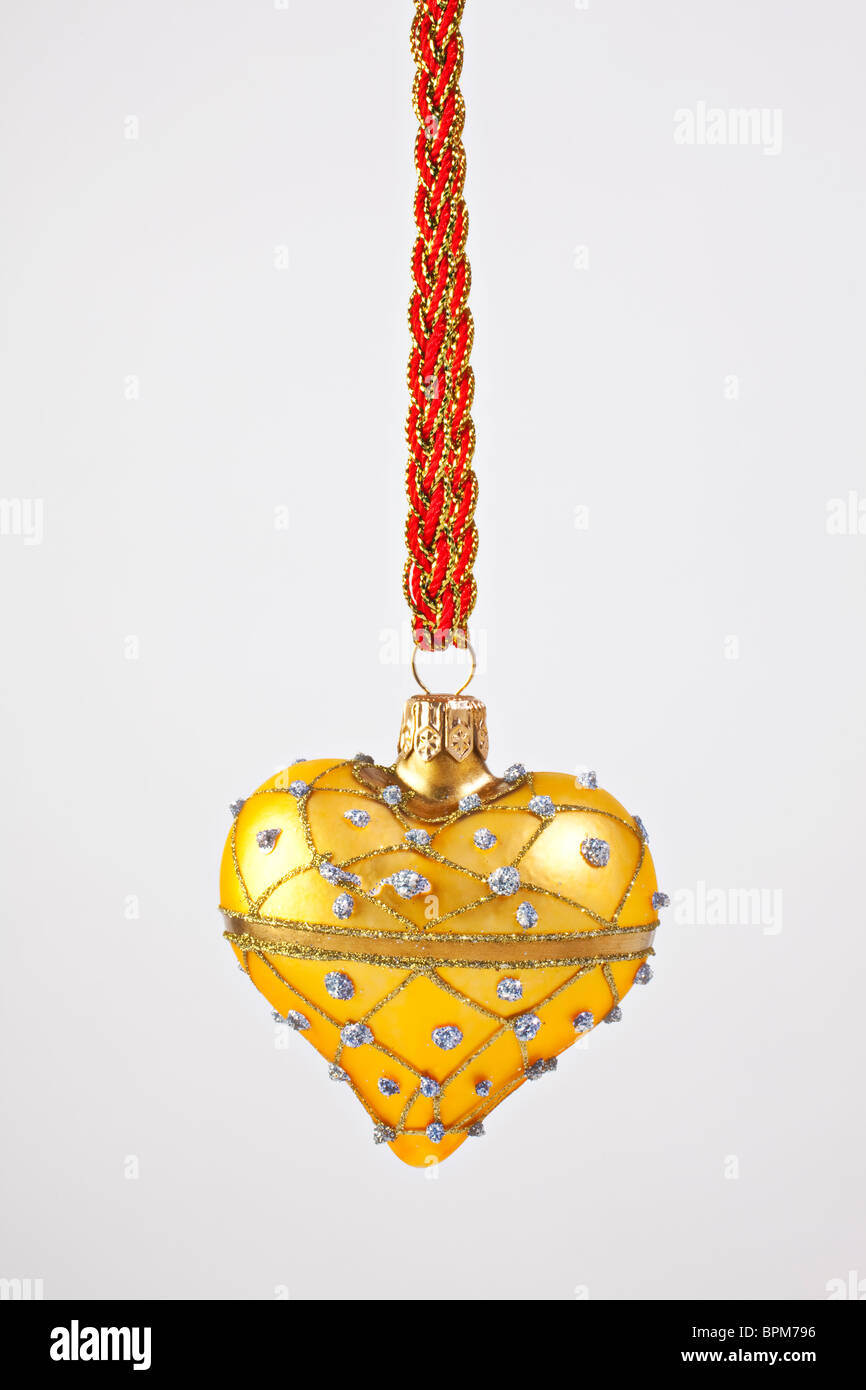 Ornement de Noël coeur d'or Banque D'Images