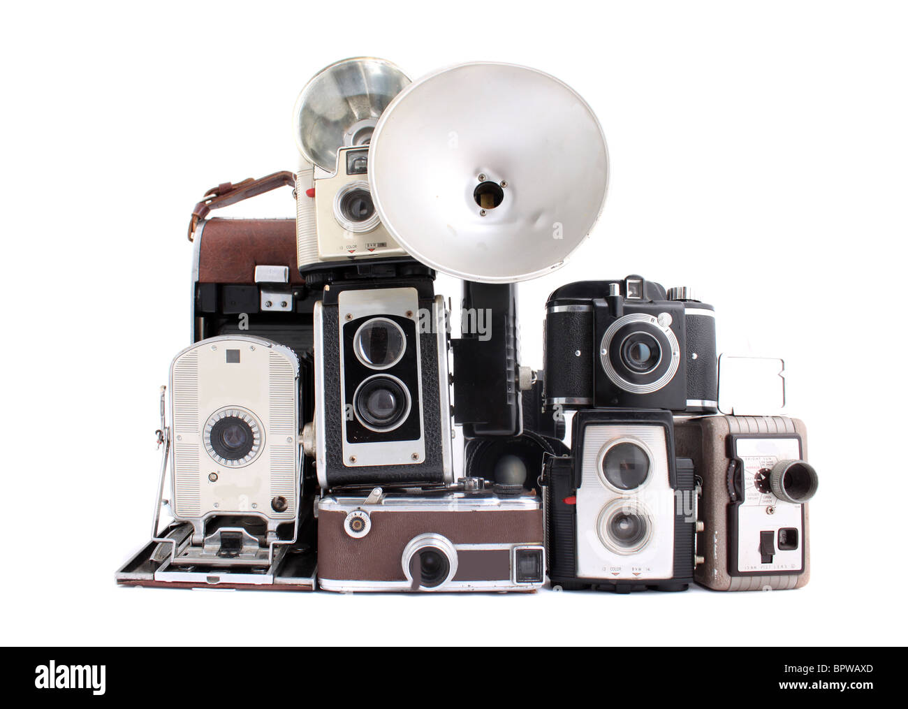 Appareils photo anciens dans une pile sur un fond blanc Banque D'Images