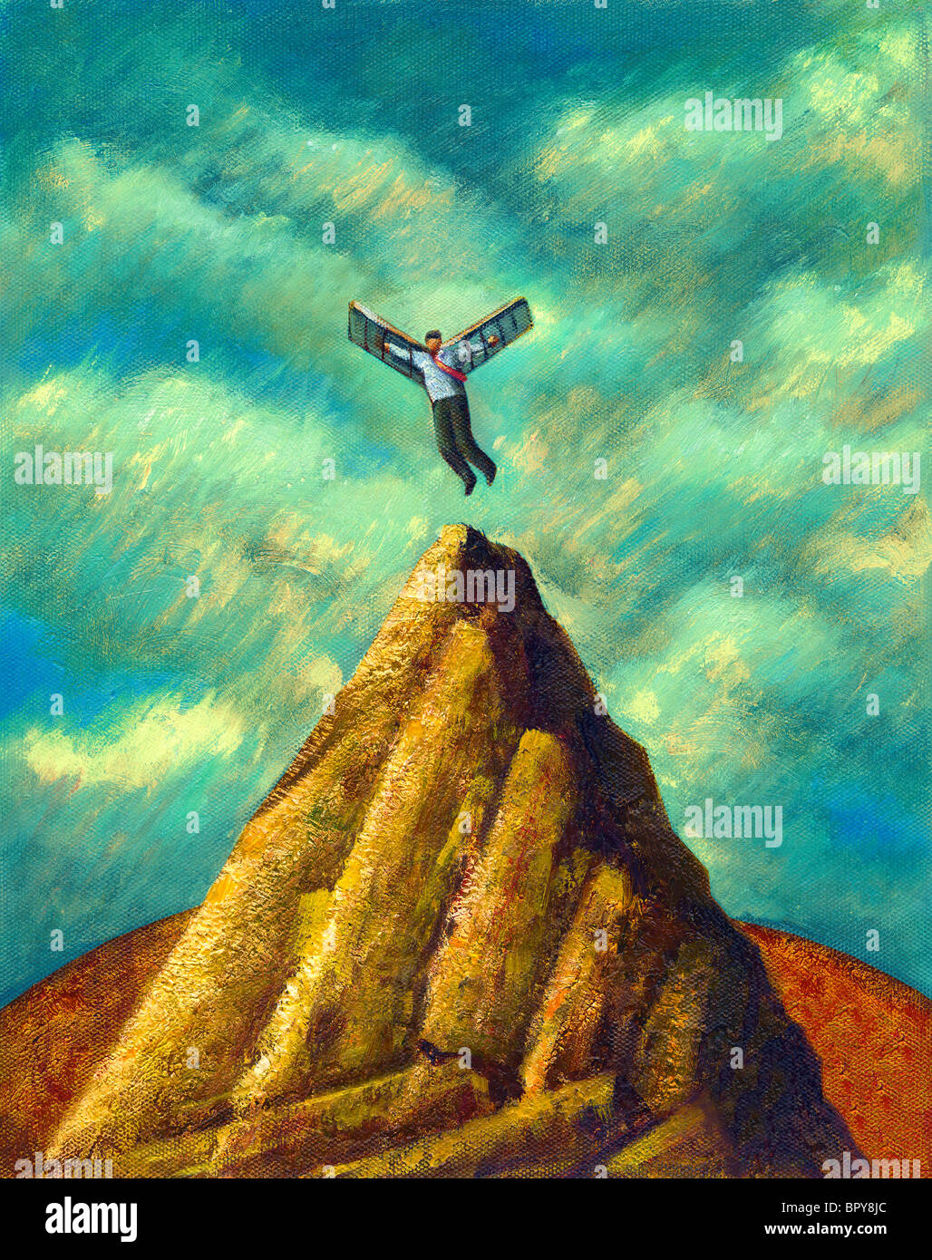 Un homme avec des ailes battant à partir d'un pic de montagne Banque D'Images