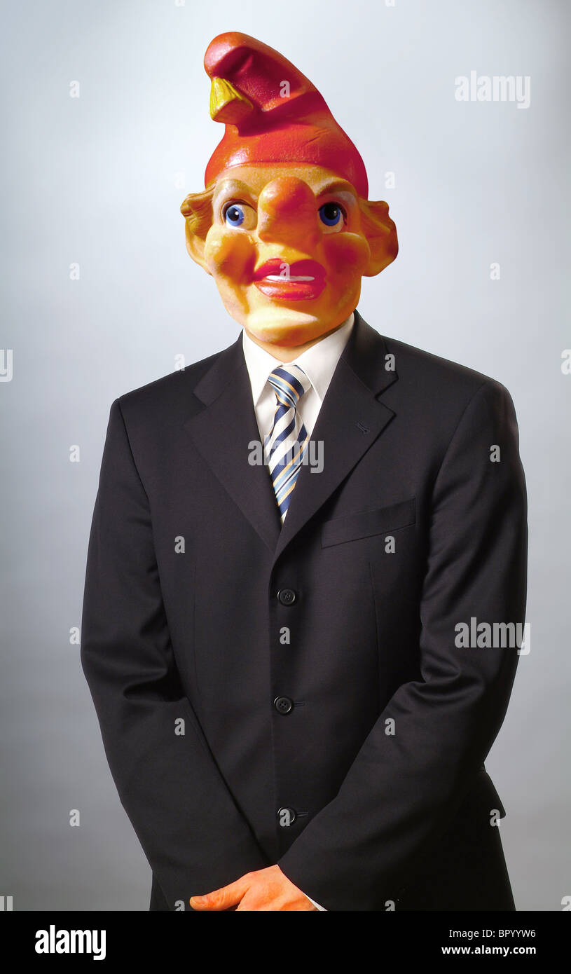 Un homme vêtu d'un masque de clown Banque D'Images