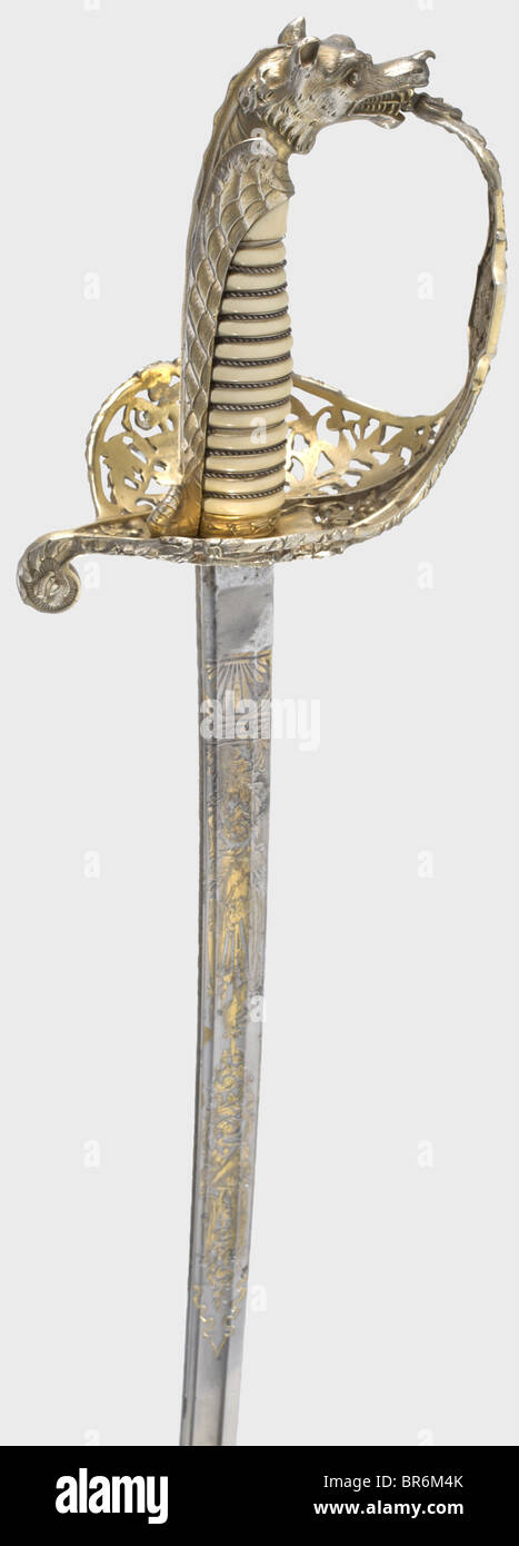 un magnifique sabre de présentation pour Charles Buxton (1823 - 1871) avec poignée ivoire et deux scabards, vers 1860. Lame de Damas à une seule lame avec un point de pandreur à double tranchant. La forte ours riche, gravé trophée et décoration tendril conservant la plupart de ses dorures. Sur le ricasso, la marque gravée 'Prouvé' et deux fois estampillée 'B' avec couronne et hexagramme, respectivement. Signé au dos 'A. Herovard - Worgard & Co'. Hilt d'arnaque ouvert d'argent doré avec trophées coupés et ciselés de guerre, fleurs et feuillage ainsi que deux canons au-dessus d'une ancre. Unclea, Banque D'Images