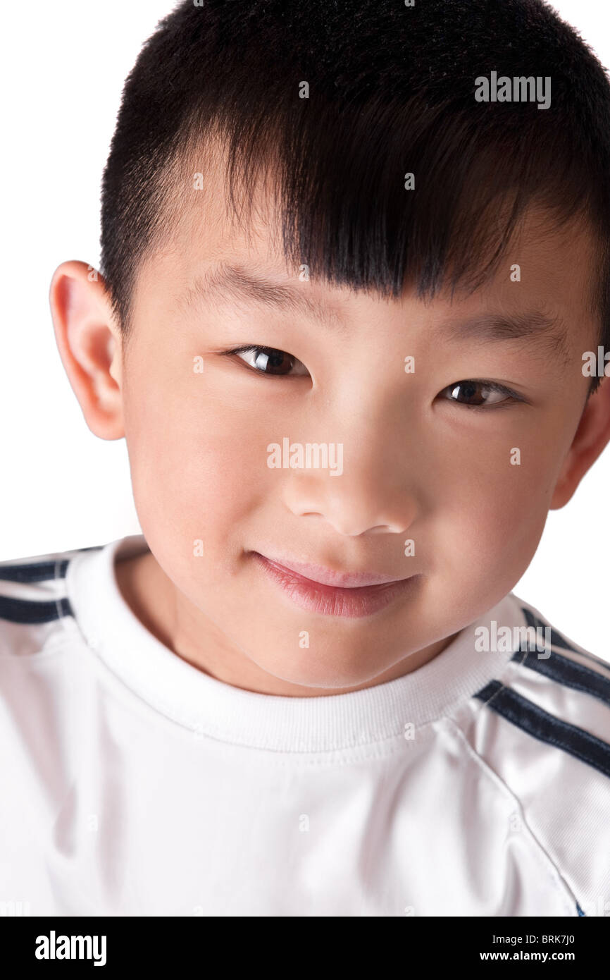 Un jeune garçon asiatique portrait portrait à une assurance white Banque D'Images