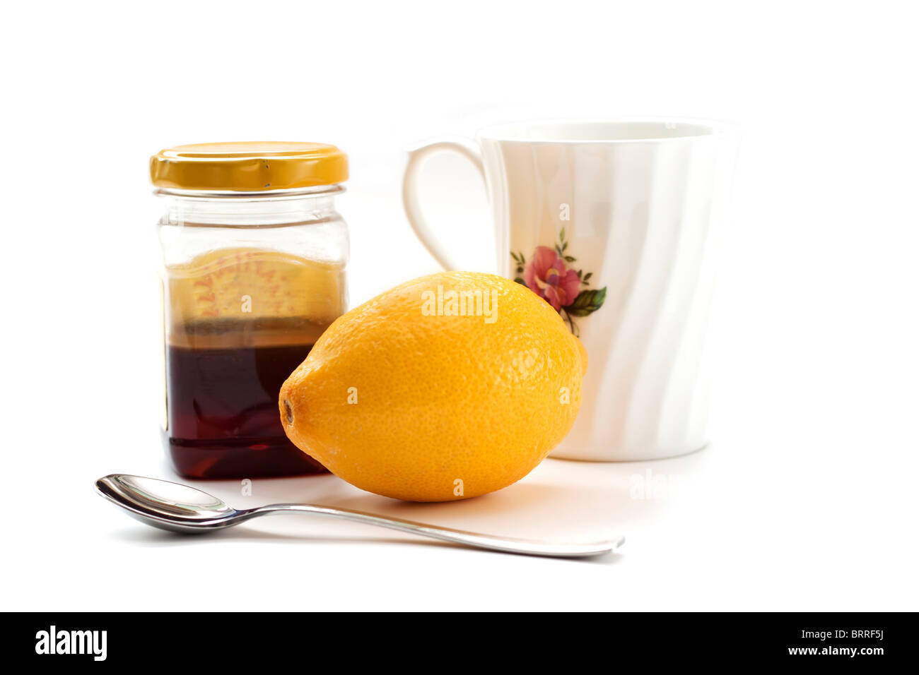 Miel et citron avec mug et cuillère Banque D'Images