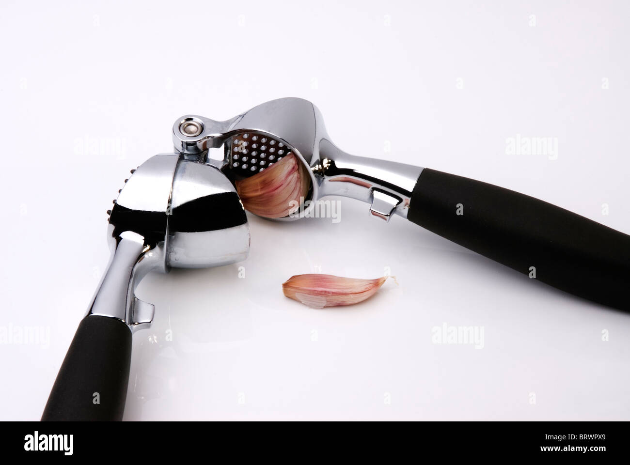 Presse-ail gousse écraser écraser Banque D'Images
