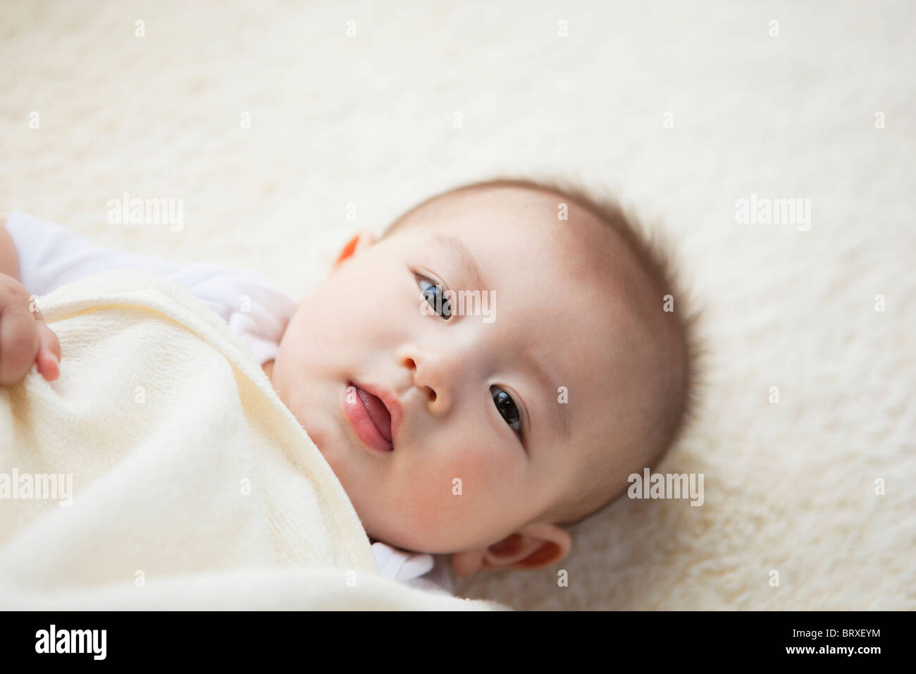 High Angle View of Baby Boy Lying on Back Banque D'Images